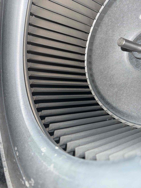 Completed comprehensive cooling maintenance on two air conditioning systems per maintenance agreement. Verified thermostat operation showing 71°F current temperature with proper heat setpoint at 65°F, inspected blower assembly revealing normal dust accumulation on squirrel cage fan blades and housing consistent with operational use, and documented system conditions through photographs for service records.