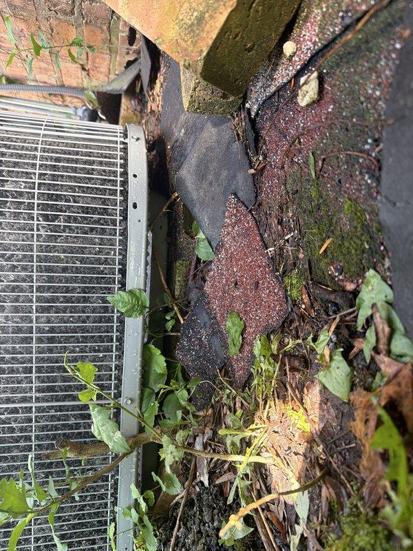 Returned to property to install new supply grills in attic space as previously scheduled. Installed white rectangular return air grille with vertical slats on galvanized ductwork, secured with professional-grade tape to ensure proper seal. Per customer request, inspected outdoor condenser unit and evaluated existing concrete pad condition. Found significant debris accumulation around condenser including leaves, organic matter, and vegetation growth on pad surface. Documented extensive weathering, dark staining, and deterioration of concrete slab with photographic evidence. Pad appears undersized for current equipment and shows signs of prolonged moisture exposure with moss and weed growth throughout area. Provided customer with photos showing current conditions for review regarding potential pad upgrade and replacement options.
