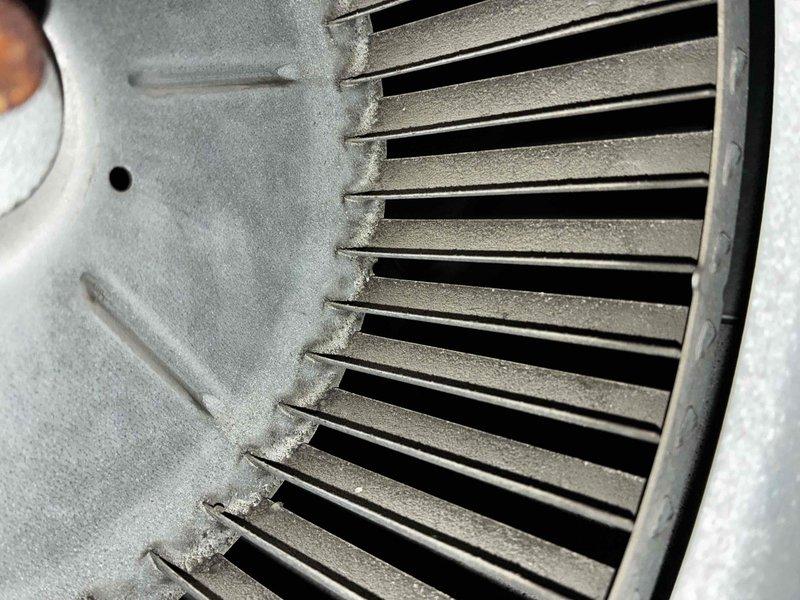Completed preventive maintenance agreement service on central air conditioning system and Unico air handler. Inspected squirrel cage blower assembly, noting dust and debris accumulation on blades and housing, which is typical of normal operation. Replaced air filter with new pleated media filter to maintain proper airflow and system efficiency.