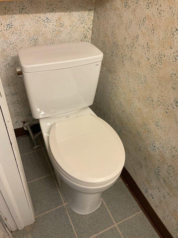 Installed a new Toto Drake round bowl, two-piece toilet with slow-close seat in bathroom alcove. Completed all plumbing connections including chrome water supply line, secured fixture to floor with proper mounting hardware, and tested for proper operation and leak-free performance.
