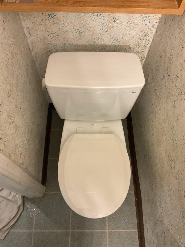 Installed a new Toto Drake round bowl, two-piece toilet with slow-close seat in bathroom alcove. Completed all plumbing connections including chrome water supply line, secured fixture to floor with proper mounting hardware, and tested for proper operation and leak-free performance.