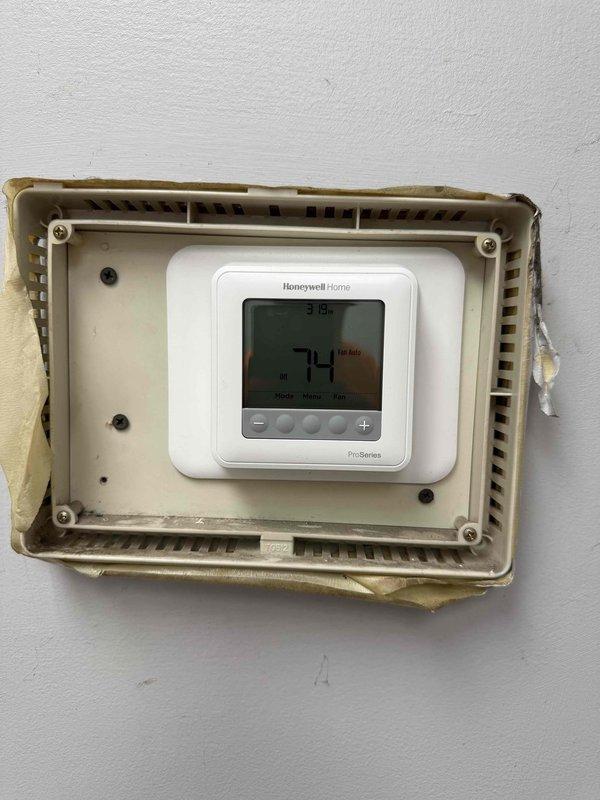 Replaced breakdown kit on lobby unit rooftop unit (RTU), installed new Honeywell ProSeries digital thermostat for garage unit, and reattached loose insulation on lobby RTU exterior panels. All equipment tested and operating within normal parameters upon completion.