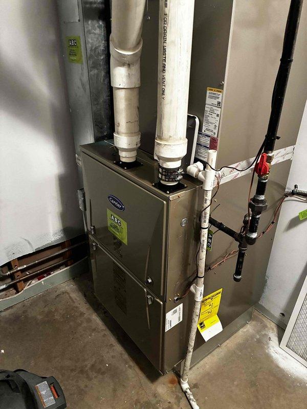 Responded to service call for inadequate airflow to multiple bedrooms, with rooms not maintaining temperature setpoints in both heating and cooling seasons. Performed system inspection of Carrier furnace and air handler installation. Evaluated ductwork configuration, supply register airflow, and static pressures throughout the distribution system. Identified insufficient air delivery to affected zones. Documented equipment installation and mechanical room layout for further assessment of duct design and potential airflow balancing requirements to resolve temperature differential issues in bedrooms.