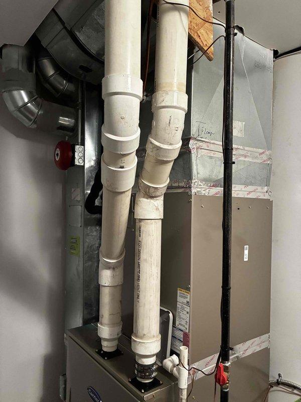 Responded to service call for inadequate airflow to multiple bedrooms, with rooms not maintaining temperature setpoints in both heating and cooling seasons. Performed system inspection of Carrier furnace and air handler installation. Evaluated ductwork configuration, supply register airflow, and static pressures throughout the distribution system. Identified insufficient air delivery to affected zones. Documented equipment installation and mechanical room layout for further assessment of duct design and potential airflow balancing requirements to resolve temperature differential issues in bedrooms.