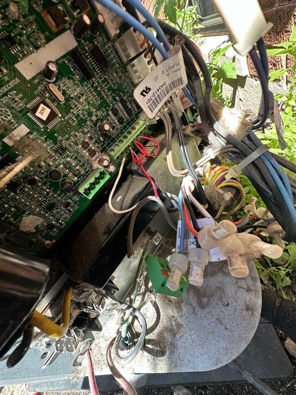 Completed preventive maintenance on outdoor air conditioning unit per maintenance agreement terms. Inspected control board, electrical connections, and wiring harness; verified all terminal connections secure and system operational. Accessed unit through rear entrance per customer request due to front doorbell malfunction.