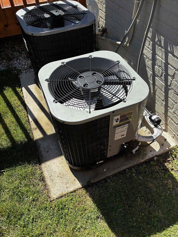 Responded to service call for AC unit not cooling properly with suspected refrigerant leak identified during home inspection. Performed comprehensive system diagnostic on residential split-system air conditioning unit. Conducted visual inspection of outdoor condenser unit, noting normal weathering consistent with age and proper installation on concrete pad with appropriate refrigerant line connections and electrical disconnect. Inspected copper refrigerant lines showing oxidation and surface patina typical of outdoor exposure. Examined evaporator coil and heat exchanger fins, observing dust and debris accumulation on surfaces. Assessed refrigerant distribution system components including U-bend copper tubing with visible discoloration and brass fittings displaying oxidation and mineral deposits. Documented equipment condition through photographic evidence for diagnostic purposes and pre-sale inspection records.