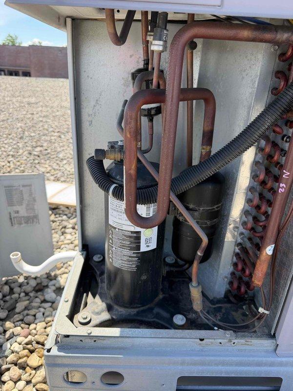 Completed commercial preventive maintenance agreement service on rooftop Carrier RTU. Inspected compressor, refrigerant lines, and electrical connections; all components found in normal operating condition with typical weathering consistent with outdoor exposure. Documentation photos captured for service records.