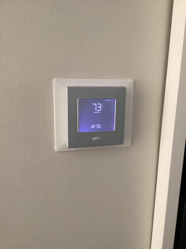 Responded to cooling complaint on first floor system with ice formation on outdoor unit. Diagnosed failed contactor causing inadequate compressor operation and reduced cooling capacity. Replaced defective contactor with new unit, restored proper system function, and verified thermostat operation showing 73°F. System now operating normally with proper cooling to affected area.