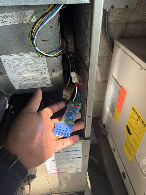 Performed diagnostic testing on HVAC system electrical components and installed surge protector device to safeguard equipment from voltage spikes and power surges. Accessed system control compartment, verified proper wire connections and voltage readings using digital multimeter, and completed installation with all safety protocols observed.
