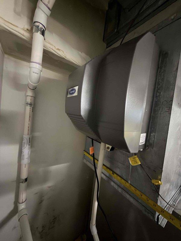 Completed full-system HVAC replacement for first-floor equipment including a 28-year-old air conditioning unit and 13-year-old furnace. Documented existing equipment location and accessibility, took measurements of exterior clearances and installation space, and assessed mechanical room conditions prior to system removal and replacement.