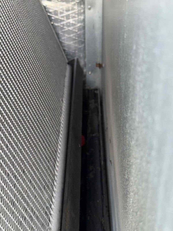 Responded to reported RTU leak and performed diagnostic inspection of rooftop unit and associated ductwork. Upon visual examination of accessible components including supply plenum, ductwork connections, and filtration system, no active refrigerant leaks or moisture intrusion were detected at time of service. Inspected recent work areas and verified all duct connections, seams, and joints showed proper sealing with no visible gaps or separation that would indicate air leakage or system compromise.