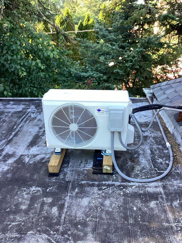 Responded to no-cooling call on mini-split system following neighborhood-wide power surge. Found indoor air handler operational and displaying temperature, but outdoor condensing unit failed to energize. Inspected rooftop condenser unit, checked electrical connections at disconnect, and verified refrigerant line sets were intact. Diagnosed failed compressor contactor due to power surge damage. Replaced contactor, restored power, and tested system operation. Unit cycled properly with both indoor and outdoor units running. Verified proper amperage draw and temperature split across evaporator coil. System restored to normal cooling operation.