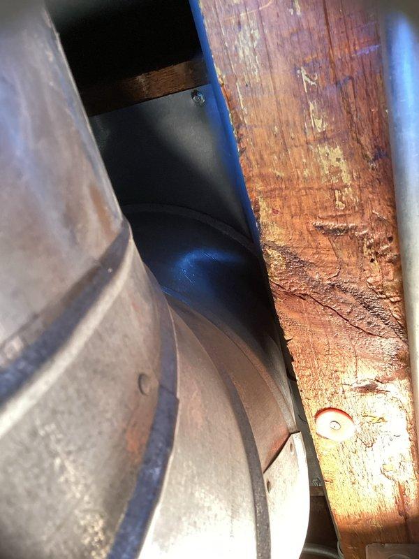 Returned to complete installation of replacement REME HALO UV bulb in existing air purification system. Removed old UV bulb from mounted housing unit within the HVAC system and installed new bulb with characteristic blue ionization element. Verified proper mounting and secure connection to black circular base housing. System tested and confirmed operational upon completion.