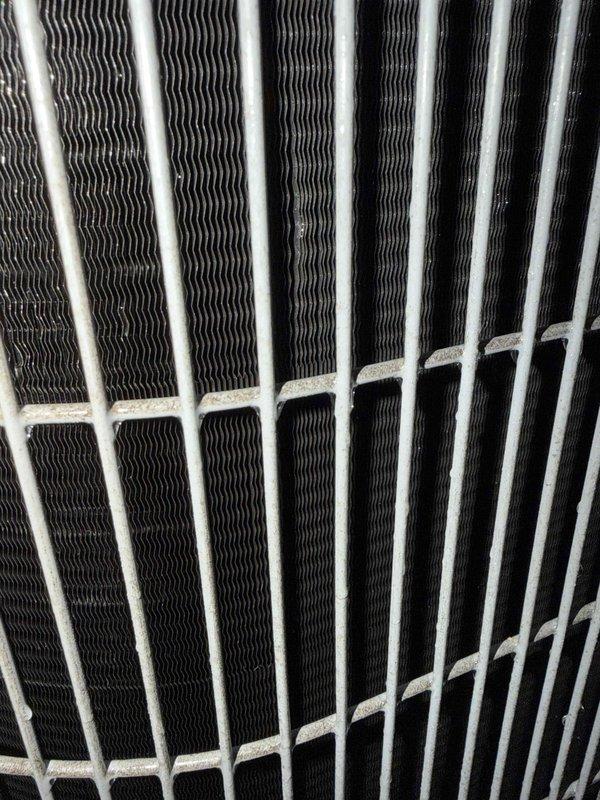 Completed comprehensive cooling check on single air conditioning system under maintenance agreement. Inspected condenser coil fins which showed good condition with proper spacing and cleanliness, and documented heavily soiled air filter with significant dust and debris accumulation requiring attention for optimal system airflow and efficiency.