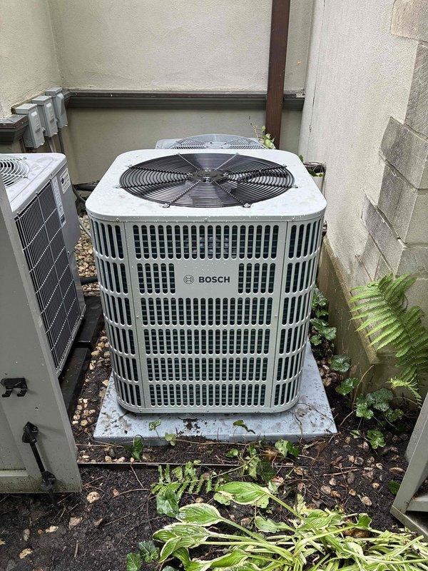 # HVAC Install - A/C Only

## Work Performed

Completed full air conditioning system replacement at residential property. Removed existing equipment and installed new Bosch outdoor condensing unit on existing concrete pad in exterior utility area. Unit positioned in side yard location with adequate clearance for service access and airflow.

Replaced indoor air handler in attic space with new unit. Installed flexible ductwork with reflective foil insulation to connect air handler to distribution system. Routed refrigerant lines through attic with black foam pipe insulation for proper temperature control and condensation prevention.

Installed new evaporator coil matched to system specifications. Added thermostatic expansion valve (TXV) to refrigerant circuit for improved efficiency and precise refrigerant metering. Ran new thermostat wiring and installed updated thermostat for system control.

Completed dispensation wiring installation to ensure proper electrical connections throughout 
