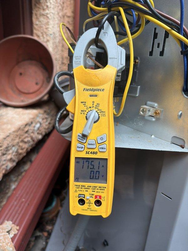 Completed preventive maintenance agreement inspection on condensing unit. Performed electrical diagnostics using clamp meter, recording voltage readings of 775.1V on system components. Inspected blower wheel assembly and verified proper operation of squirrel cage fan. All components found operating within normal parameters and system running efficiently.