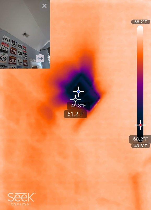 Responded to callback for recent system installation where one bedroom was not receiving adequate airflow, resulting in room temperature of 85°F despite thermostat set to 77°F. Upon inspection, discovered supply duct disconnection or significant restriction in the affected bedroom's ductwork. Thermal imaging confirmed temperature differential of approximately 18-20°F between the problem area and properly conditioned spaces, with readings showing 49.8°F at supply points and 68.2°F in adjacent areas. Accessed ductwork through interior inspection, documented disconnected or collapsed flex duct section preventing conditioned air delivery to the bedroom. Reconnected and secured supply duct, verified proper airflow restoration and temperature balance throughout the residence.