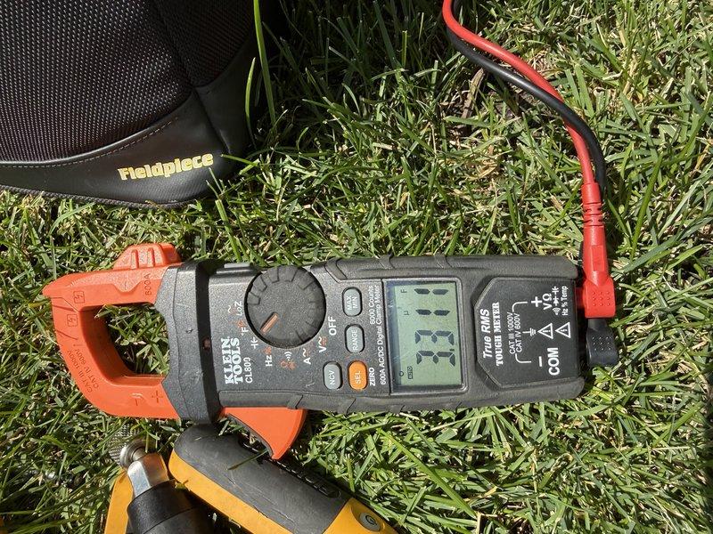 Responded to a no-cool call on a 3-year-old air conditioning system affecting the entire home. Upon arrival, performed diagnostic testing of the outdoor unit's electrical components, including capacitor and contactor assembly. Used clamp meter to verify amperage draw and confirmed system was operating at 33.33 amps. Inspected indoor equipment connections and control wiring. System restored to normal cooling operation.