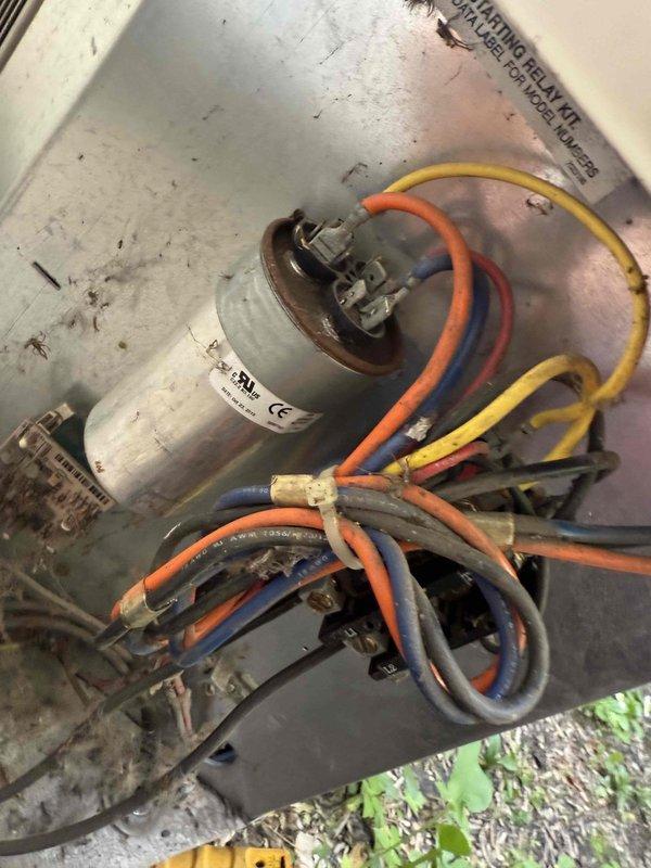 Responded to no cooling complaint on 10+ year old AC unit with easy access. Upon inspection, diagnosed failed dual run capacitor preventing compressor and condenser fan operation. Replaced defective capacitor with properly rated universal replacement, verified all electrical connections secure, and tested system operation. Unit restored to normal cooling function with compressor and outdoor fan motor running within specifications.
