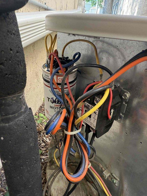 Responded to no cooling complaint on 10+ year old AC unit with easy access. Upon inspection, diagnosed failed dual run capacitor preventing compressor and condenser fan operation. Replaced defective capacitor with properly rated universal replacement, verified all electrical connections secure, and tested system operation. Unit restored to normal cooling function with compressor and outdoor fan motor running within specifications.