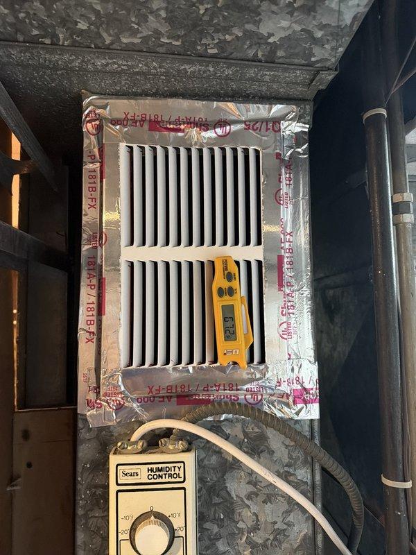 Responded to callback for coil freezing issue on recently installed AC-only system. Performed diagnostic inspection of furnace blower operation using multimeter and borescope camera to assess airflow and internal ductwork conditions. Investigated potential airflow restrictions at filter housing and humidity control unit, documenting system configuration and internal duct conditions for further analysis of inadequate air circulation causing coil freeze-up.