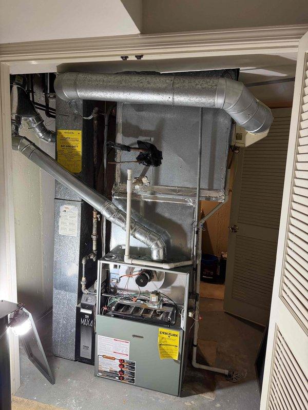 Responded to no cooling complaint on 10+ year old system. Found evaporator coil completely iced over due to blower motor failure. Connected manifold gauges to assess system pressures after coil defrosted. Blower motor inoperative, preventing proper airflow across evaporator coil and causing ice buildup. Quoted customer for blower motor replacement and necessary repairs to restore cooling function.
