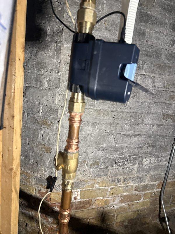 Responded to callback regarding low water pressure alerts occurring over the past week. Inspected plumbing installation in basement mechanical room, including copper supply lines, brass compression fittings, and electronic pressure monitoring device mounted on concrete block wall. Evaluated system connections, valve operations, and pressure regulation components to identify source of PSI drops. Verified all brass fittings and joints were properly secured and checked for potential leaks or air infiltration that could affect pressure readings. Tested pressure monitoring device functionality and confirmed system integrity to ensure no immediate risk of system failure or water damage.