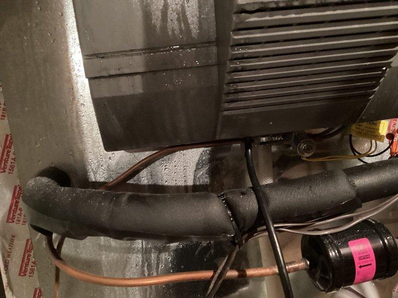 Responded to no cooling call with thermostat displaying no power. Upon inspection, discovered loose connection at RF cord terminal on air handler, which was preventing power transmission to thermostat. Secured electrical connection, restored power to thermostat, and verified system operation with proper cooling function restored.