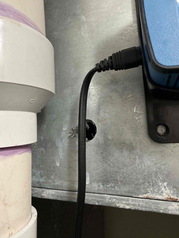 Responded to no cooling call with thermostat displaying no power. Upon inspection, discovered loose connection at RF cord terminal on air handler, which was preventing power transmission to thermostat. Secured electrical connection, restored power to thermostat, and verified system operation with proper cooling function restored.