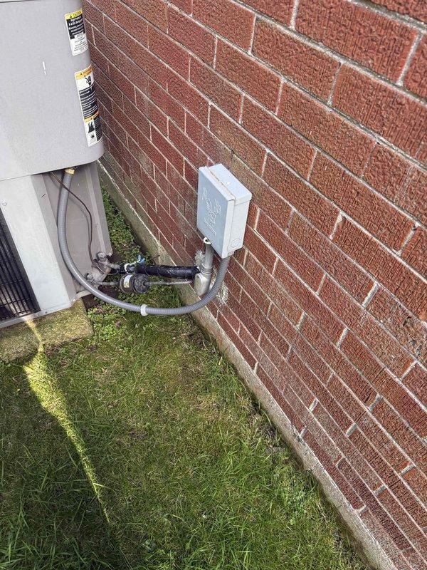Performed comprehensive system evaluation on non-cooling air conditioning unit after customer received replacement recommendations from other contractors. Conducted thorough diagnostic assessment of existing outdoor condensing unit, refrigerant lines, and electrical connections mounted at exterior brick wall location. Documented current equipment condition including weathered components, aged infrastructure, and environmental wear on existing HVAC installation. Provided detailed estimate for complete system replacement including new condensing unit, air handler, refrigerant lines, electrical disconnects, and associated materials required for full installation.