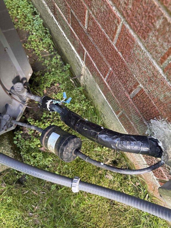 Performed comprehensive system evaluation on non-cooling air conditioning unit after customer received replacement recommendations from other contractors. Conducted thorough diagnostic assessment of existing outdoor condensing unit, refrigerant lines, and electrical connections mounted at exterior brick wall location. Documented current equipment condition including weathered components, aged infrastructure, and environmental wear on existing HVAC installation. Provided detailed estimate for complete system replacement including new condensing unit, air handler, refrigerant lines, electrical disconnects, and associated materials required for full installation.