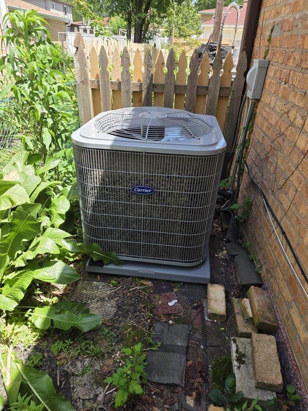 Responded to callback for newly installed system experiencing freezing issues and high static pressure drop across evaporator coil. Inspected sheet metal coil pan and discovered airflow restriction causing inadequate air movement through the coil. Documented existing conditions with photos of indoor coil assembly and outdoor condensing unit. Verified system installation and identified source of performance issue related to ductwork configuration at coil pan.