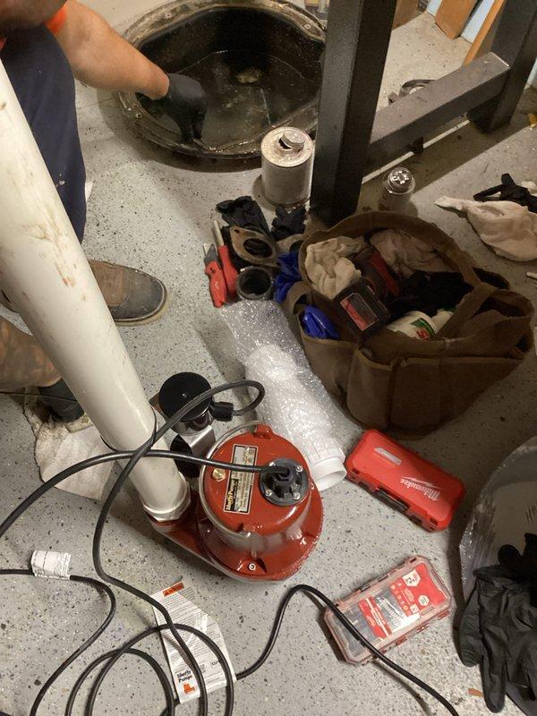 Responded to emergency call for water backing up into basement. Performed camera inspection of main sewer line to diagnose the cause of the backup. Removed and serviced the existing sump pump system, which showed signs of wear and contamination. Cleaned the sump basin, removed debris, and reinstalled pump components with proper discharge piping connections. Verified system operation and confirmed water was being properly evacuated from the basement area to prevent further flooding.