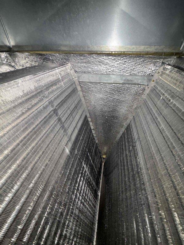 Completed scheduled HVAC maintenance agreement service on CC 1 condenser unit. Verified Carrier thermostat operation showing proper functionality in auto mode with heat setpoint at 65° and cool setpoint at 68°, current room temperature reading 71°. Inspected ductwork and plenum assembly with reflective foil-faced insulation in satisfactory condition. Customer typically provides their own 24x24 dynamic filter as this is not included in the maintenance agreement. System operational and performing within normal parameters.