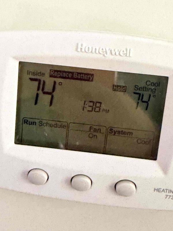 Completed comprehensive HVAC maintenance agreement service on two air conditioning systems, with one unit excluded per customer request. Performed standard fall preventive maintenance inspections including examination of electrical components, capacitors, and control systems. Observed significant corrosion and rust on capacitor mounting hardware and terminal connections, along with aged wiring showing discoloration; noted thermostat displaying low battery warning requiring replacement. All systems operational at time of service completion with photographic documentation captured for maintenance records.
