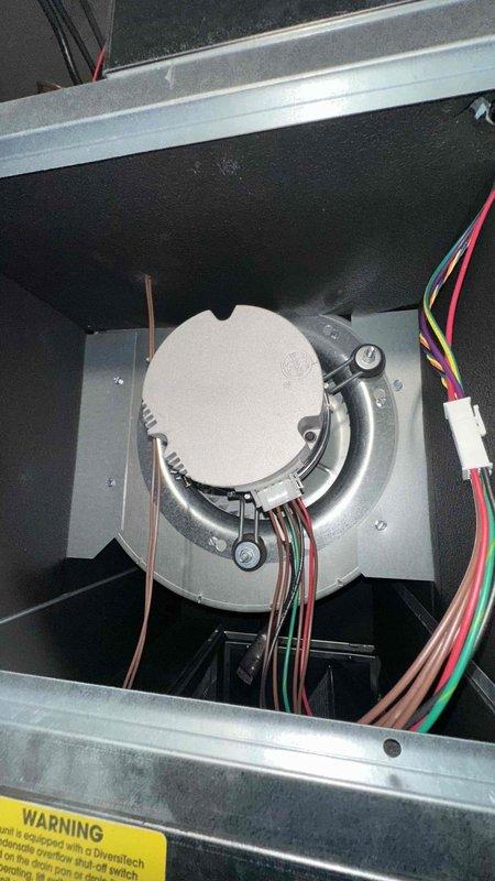 Completed preventive maintenance inspection on five-year-old air conditioning system with no reported issues or symptoms. Performed comprehensive system evaluation including supply air temperature measurements at ductwork (128.1°F recorded), visual inspection of blower motor assembly and electrical connections, and verification of refrigerant lines and internal components. All equipment operating within normal parameters with no deficiencies noted.