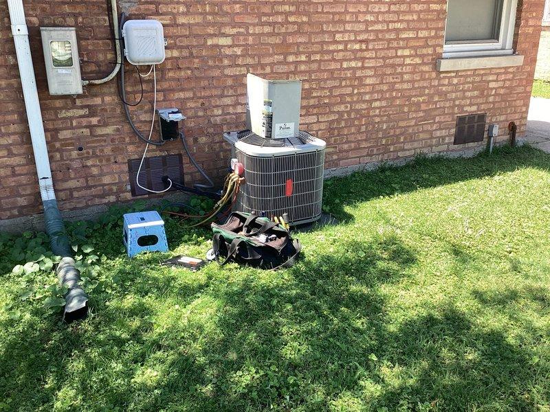 Responded to no cooling complaint on residential HVAC system less than 10 years old. Upon arrival, accessed indoor air handler unit and inspected internal components including blower motor, electrical connections, and control boards. Proceeded to outdoor condenser unit where compressor was found to be inoperative. Removed failed compressor from outdoor unit and staged replacement component on-site. Documented existing refrigerant line connections and electrical wiring configuration. System required compressor replacement to restore cooling functionality.
