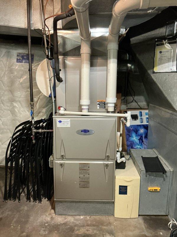 Completed routine maintenance agreement inspection on Carrier Infinity system. Performed comprehensive system evaluation of furnace and air conditioning components, verified thermostat operation and dehumidification function, and documented equipment condition with photographic records showing all components operating within normal parameters.
