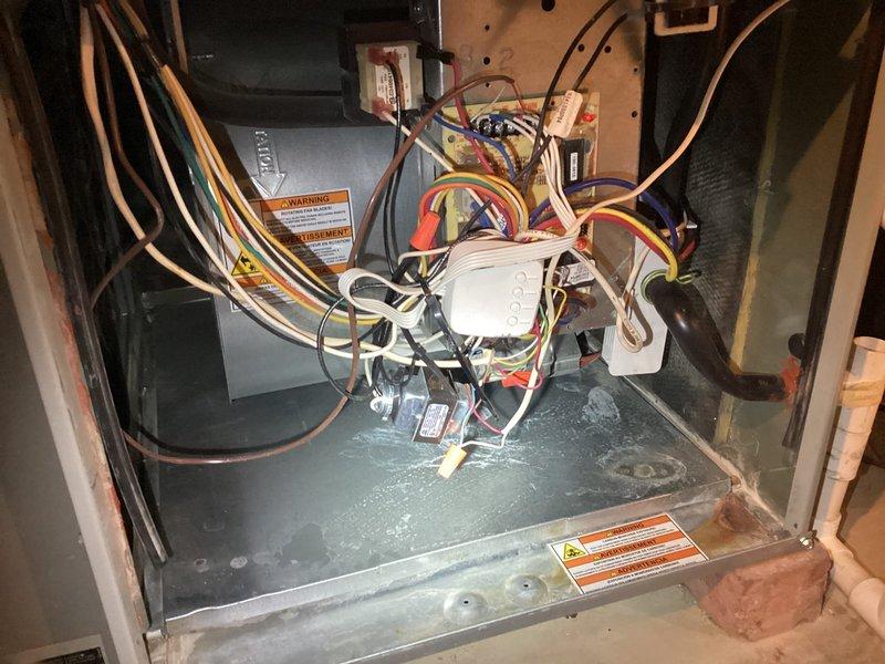 Performed comprehensive system evaluation for new homeowner transitioning service providers. Inspected air handler unit in attic space, documented equipment information including model and serial numbers for warranty transfer purposes. Verified all electrical connections, control board operation, and capacitor functionality. Confirmed thermostat communication and temperature control settings at 69 degrees. System operating within normal parameters with no cooling deficiencies identified at time of inspection.