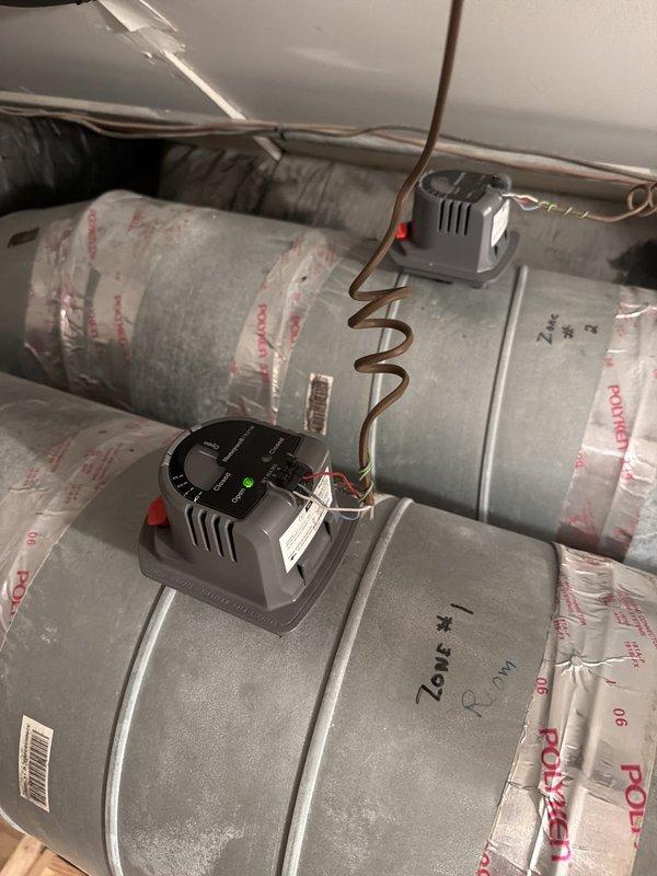 Returned to site with replacement zone damper motor and consulted with technical support regarding zone control system malfunction. Replaced faulty damper motor on Zone #4 ductwork and verified proper communication between zone controller and damper actuator. Confirmed all zone dampers responding correctly to thermostat calls and system operating within normal parameters.