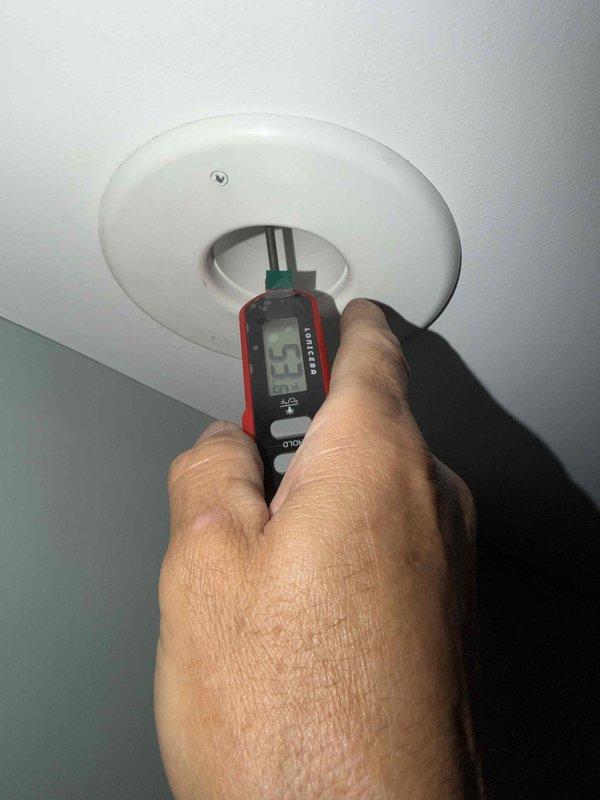 Responded to no cooling complaint on one-year-old system experiencing inadequate cooling from 3:00 PM through 9:30 PM daily. Performed diagnostic testing of supply air temperatures at ceiling register, recording measurements to verify cooling output. Inspected attic ductwork and identified issues with flexible duct installation showing signs of deterioration and inadequate insulation coverage. Measured supply air temperature at duct run reading 23.7°F temperature differential, indicating potential airflow restriction or heat gain through compromised duct insulation. Documented conditions with photos for further evaluation and recommended ductwork remediation to resolve afternoon cooling deficiency.