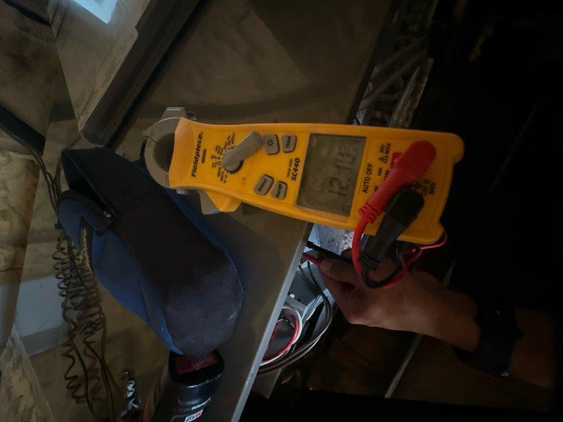 Completed comprehensive maintenance agreement service on split system HVAC equipment. Performed electrical diagnostics at outdoor condensing unit, verifying proper voltage and amperage at disconnect box. Accessed indoor air handler unit in attic space and tested capacitor performance, recording capacitance reading of 32.14 microfarads to ensure component is operating within manufacturer specifications. All electrical connections inspected and found secure with no signs of overheating or deterioration. System operational and performing to standards upon completion of maintenance inspection.