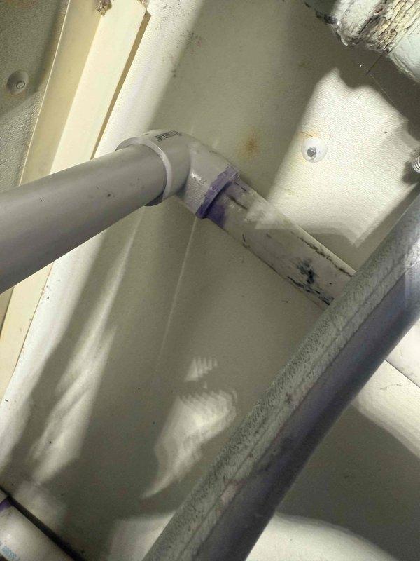 Responded to callback for condensate drain issue on recently installed unit where water was shooting from condensate pipe. Upon inspection, discovered improperly sized or connected PVC condensate drain line causing water discharge problem. Corrected condensate drain piping configuration, ensuring proper slope and secure connections with appropriate primer and cement application. Verified condensate system now draining properly without leaks or water discharge issues.