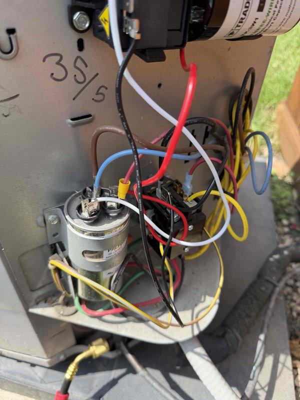 Responded to callback for AC not cooling and making noise. Upon arrival, found evaporator coil completely frozen over with heavy frost accumulation, measuring 57°F at the coil surface. Inspected electrical components and capacitor connections, which appeared intact with proper wiring configuration. Diagnosed frozen coil as result of restricted airflow due to lack of maintenance. System shutdown to allow coil to thaw before further evaluation could be completed.