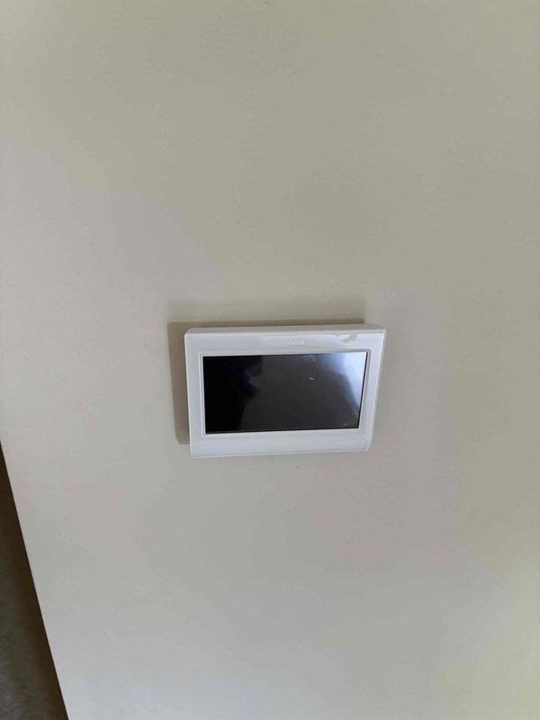 Conducted comprehensive heating system replacement estimate for 16-year-old furnace. Evaluated existing HVAC infrastructure including dual outdoor condenser units and indoor climate control system. Documented current equipment condition, system configuration, and thermostat setup with photographic evidence to provide accurate replacement recommendations and specifications.