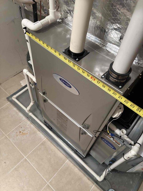 Provided estimate for complete replacement of existing Carrier air conditioning system. Performed site assessment and took measurements of current furnace and HVAC equipment to determine proper sizing and configuration for new unit installation. Documented existing PVC venting system, condensate drainage lines, and ductwork layout to ensure compatibility with replacement equipment. Evaluated mechanical room space constraints and existing infrastructure including electrical connections, refrigerant lines, and insulated ductwork. Quote includes removal of old equipment and installation of new Carrier AC system with all necessary connections and modifications.