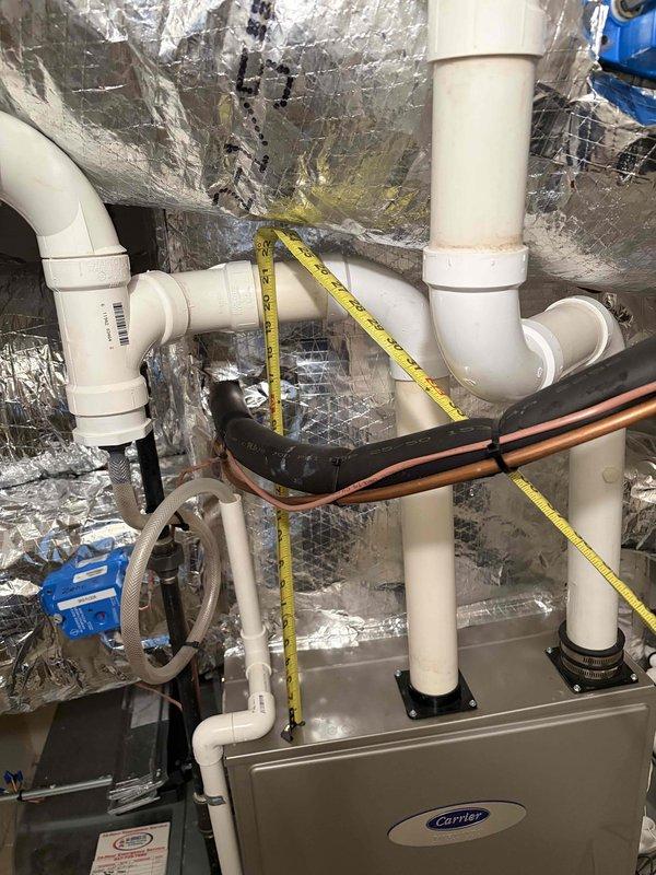 Provided estimate for complete replacement of existing Carrier air conditioning system. Performed site assessment and took measurements of current furnace and HVAC equipment to determine proper sizing and configuration for new unit installation. Documented existing PVC venting system, condensate drainage lines, and ductwork layout to ensure compatibility with replacement equipment. Evaluated mechanical room space constraints and existing infrastructure including electrical connections, refrigerant lines, and insulated ductwork. Quote includes removal of old equipment and installation of new Carrier AC system with all necessary connections and modifications.