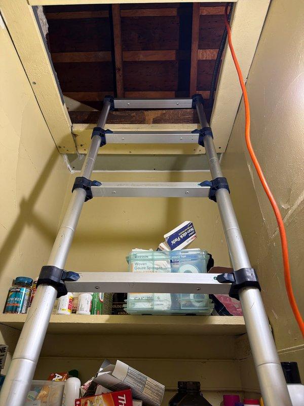 Responded to service call for slow-draining furnace condensate line in attic space. Accessed attic via pull-down ladder, located HVAC system and identified clogged condensate drain line. Cleared blockage by blowing out drain line to restore proper drainage flow and prevent potential water damage or system shutdown.