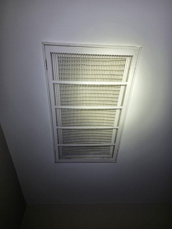 Replaced condenser unit under warranty coverage. Upon completion, inspected air return vents and documented existing dust accumulation on grille louvers for homeowner awareness. System operational and functioning within manufacturer specifications.