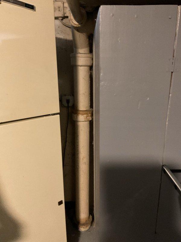 Completed comprehensive three-level plumbing inspection of residential property including basement, two full bathrooms, and one half bathroom. Thoroughly examined sump pump system in basement utility area, documenting vertical discharge pipe assembly with PVC sections and black couplings, verifying proper installation of float switch mechanism and electrical connections. Observed existing rust staining on pipe joints and fittings, noting age-related surface wear on plumbing components. Inspected auxiliary utility piping, electrical junction boxes, and associated wiring runs along basement walls. Photographic documentation captured for all critical plumbing fixtures and mechanical systems throughout all levels of the residence.